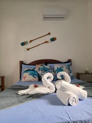 Uma cama ou camas num quarto em Kite and Dreaming Hotel