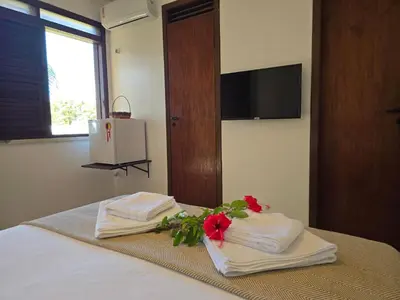 Uma televisão e/ou sistema de entretenimento em Kite and Dreaming Hotel