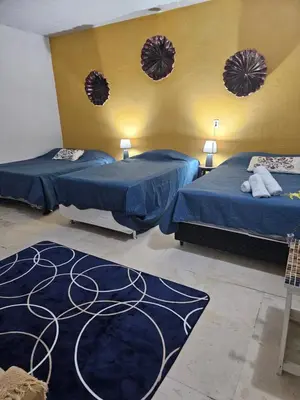 Uma cama ou camas num quarto em Shanti Om Refúgio Pousada e Yoga