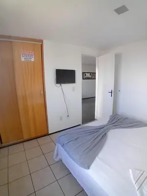 Uma cama ou camas num quarto em Apartamento Vista Mar