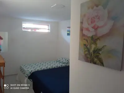 Uma cama ou camas num quarto em Casa Dférias Icaraizinho - piscina, cascata hidro