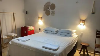 Uma cama ou camas num quarto em Vila Ybirá
