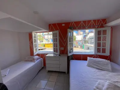 Uma cama ou camas num quarto em Pousada Oásis