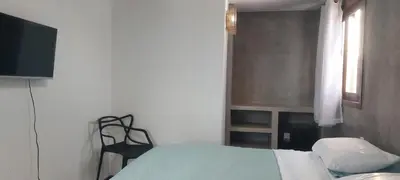 Uma cama ou camas num quarto em ROOFTOP Suítes JERI