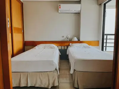 Uma cama ou camas num quarto em Conforto e Vista Maravilhosa no Hotel Iate Plaza
