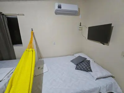 Uma cama ou camas num quarto em Pousada Mar de Iracema