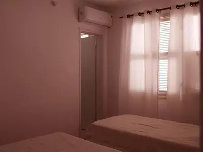Uma cama ou camas num quarto em Vila jardim!