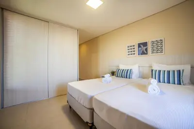 Uma cama ou camas num quarto em Villas Luxury Collection by The Coral