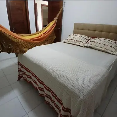 Uma cama ou camas num quarto em Vila Nordestina