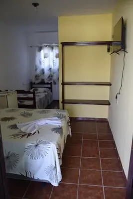 Uma cama ou camas num quarto em Pousada Panorama do Mar