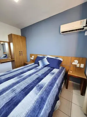 Uma cama ou camas num quarto em Lindo apartamento próximo ao Beach Park