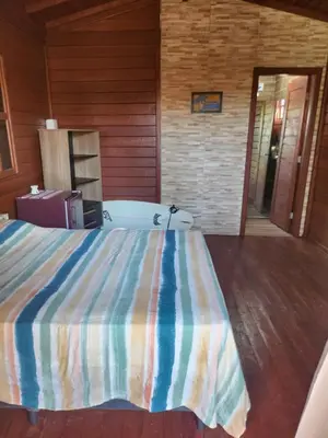 Uma cama ou camas num quarto em Vila do Rico