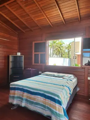 Uma cama ou camas num quarto em Vila do Rico