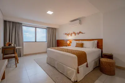Uma cama ou camas num quarto em Afago Mareiro Hotel