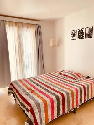 Uma cama ou camas num quarto em DUPLEX TAIBA BEACH RESORT