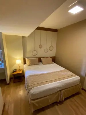 Uma cama ou camas num quarto em Magna Praia Hotel