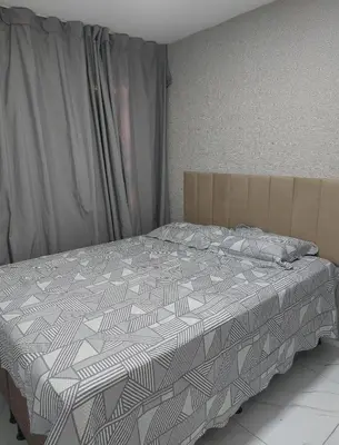 Uma cama ou camas num quarto em Fortaleza próx centro de eventos, iguatemi