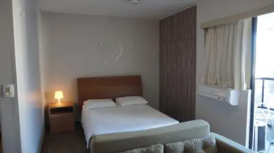 Uma cama ou camas num quarto em Via Venetto Flat - no melhor bairro de Fortaleza