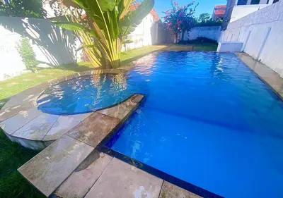 A piscina em ou perto de Casa 3 Quartos, 50 metros Da Praia