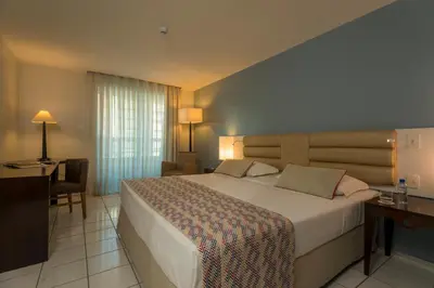 Uma cama ou camas num quarto em Hotel Luzeiros Fortaleza