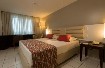 Uma cama ou camas num quarto em Hotel Luzeiros Fortaleza