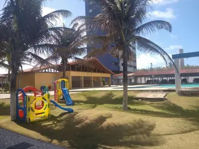 A área de jogos para crianças em Belo apartamento projetado e vista total mar !