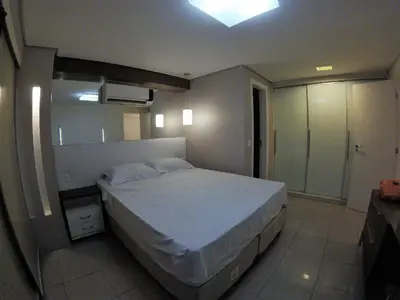 Uma cama ou camas num quarto em Localização TOP e comodidade na incrível cobertura