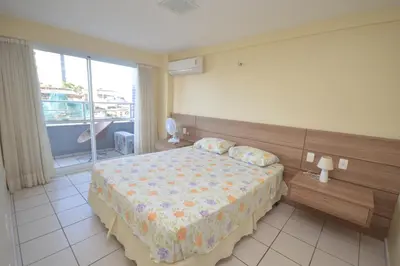 Uma cama ou camas num quarto em Praia Iracema Apartment