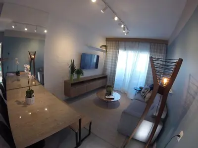 Uma área de estar em Lindo apartamento com vista mar 2 quartos 1501