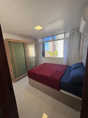 Uma cama ou camas num quarto em Apartamento alto padrão moderno frente a praia com 2 quartos melhor localização beira mar