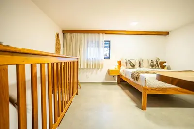 Uma cama ou camas num quarto em Arara House • Hospedagem Premium em Jeri