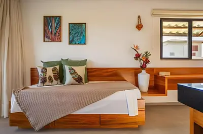 Uma cama ou camas num quarto em Arara House 2 • Charme e Tranquilidade