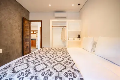 Uma cama ou camas num quarto em Nordisch- Chalés