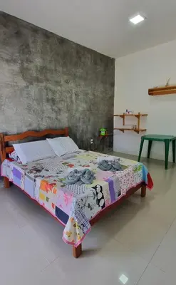 Uma cama ou camas num quarto em Lazer Paracuru