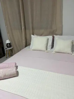 Uma cama ou camas num quarto em Casinha Azul Taiba