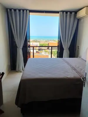 Uma cama ou camas num quarto em Casa de praia do Zeca