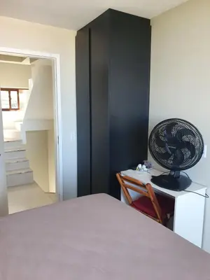 Uma cama ou camas num quarto em Casa de praia do Zeca