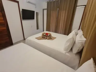 Uma cama ou camas num quarto em Chalé dos Anjos
