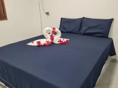Uma cama ou camas num quarto em Chalé dos Anjos