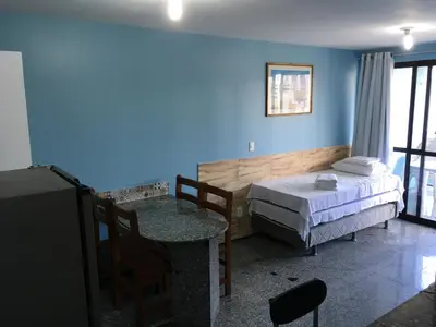 Uma cama ou camas num quarto em Flat Atlântico 1402