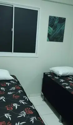 Uma cama ou camas num quarto em Apartamento Messejana 101