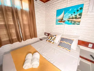 Uma cama ou camas num quarto em Hotel Sunshine Centro Cumbuco