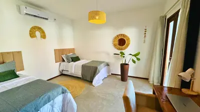 Uma cama ou camas num quarto em Lar Tropical