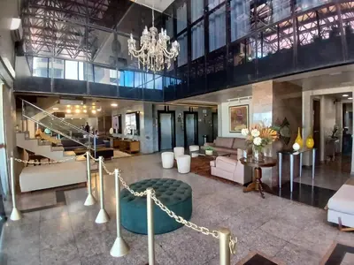 Uma área de estar em Iracema Residence Frente Mar by Escala Imóveis