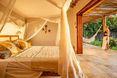 Uma cama ou camas num quarto em Villa Dodô Barrinha de baixo Prea Kite point com café da manha