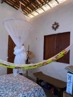 Uma cama ou camas num quarto em casa arandu