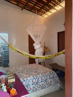Uma cama ou camas num quarto em casa arandu