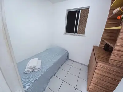 Uma cama ou camas num quarto em Apê Pertinho - Fortaleza, Ceará!