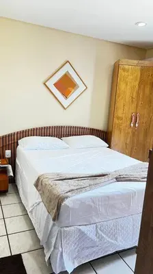 Uma cama ou camas num quarto em Flat Mobiliado na Beira Mar
