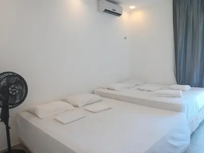 Uma cama ou camas num quarto em EmanuelleSales - Corretora de Imóveis - 